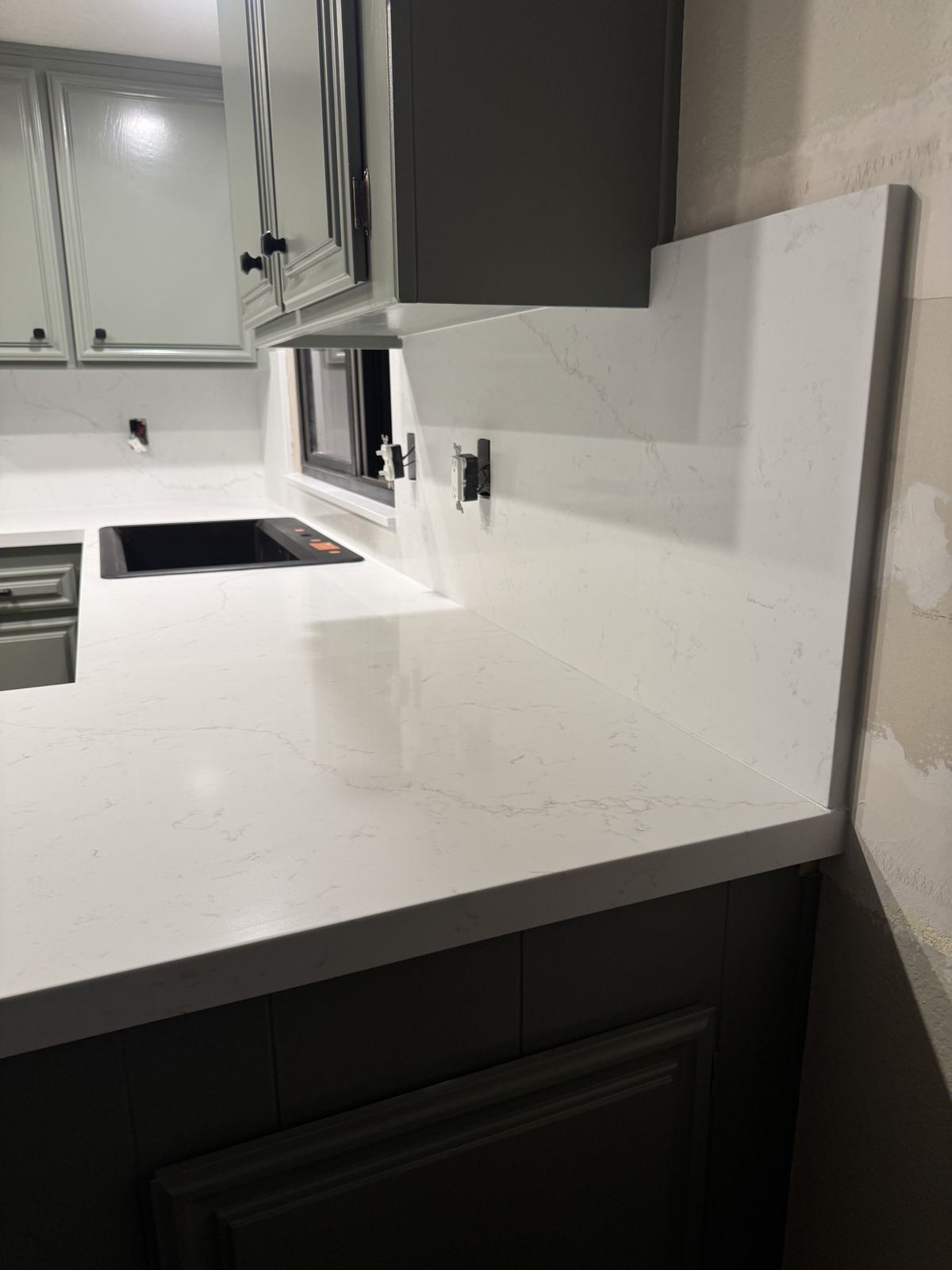 Full kitchen remodel — white quartz with full-height backsplash — kitchen countertop installation