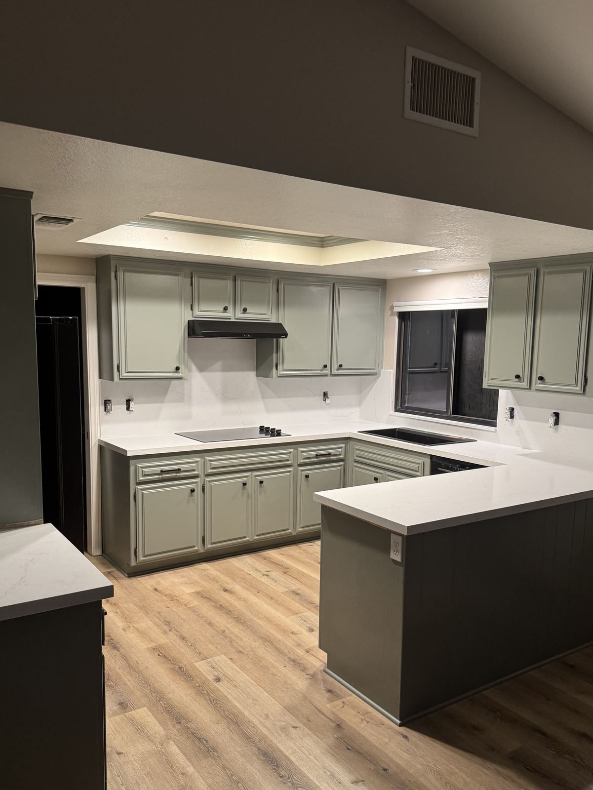 Kitchen remodel, peninsula seating and quartz throughout — kitchen countertop installation