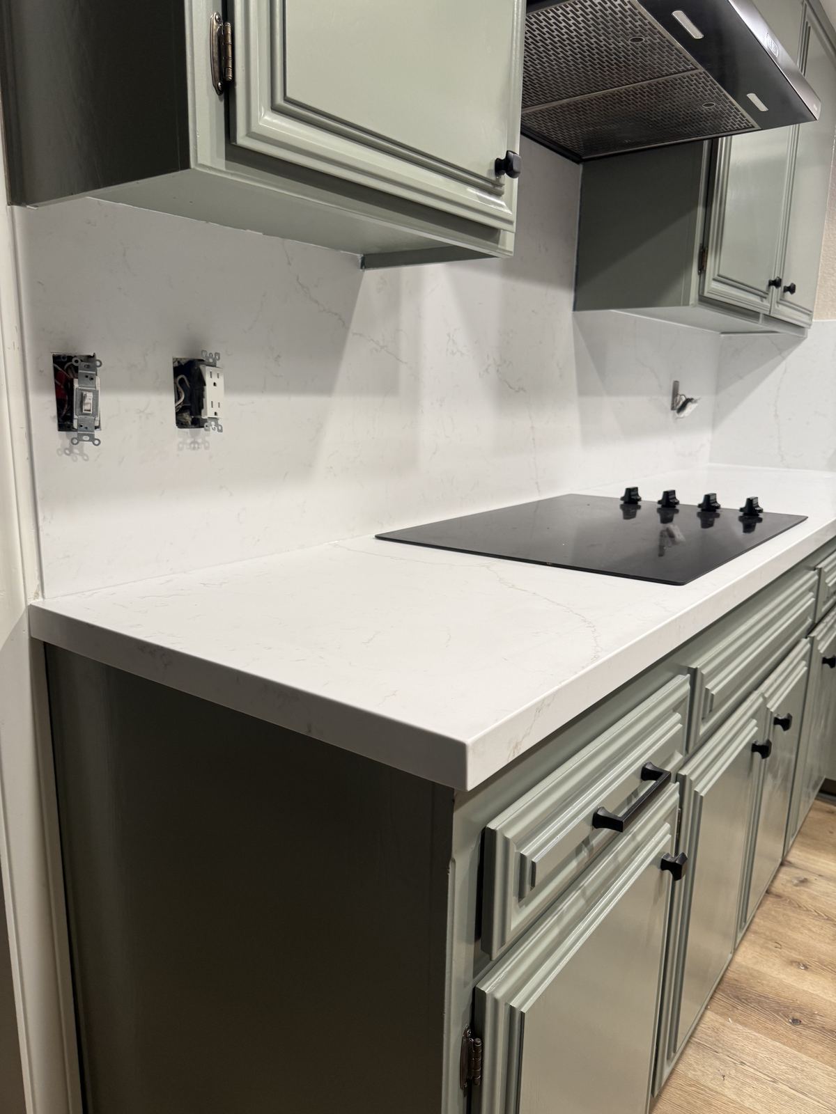 Mitred-edge quartz on the cooktop run — kitchen countertop installation