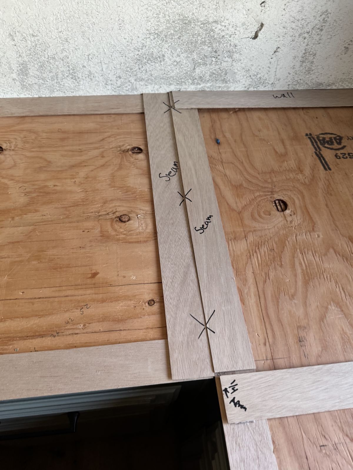 Seams marked and planned before the cut — countertop fabrication process