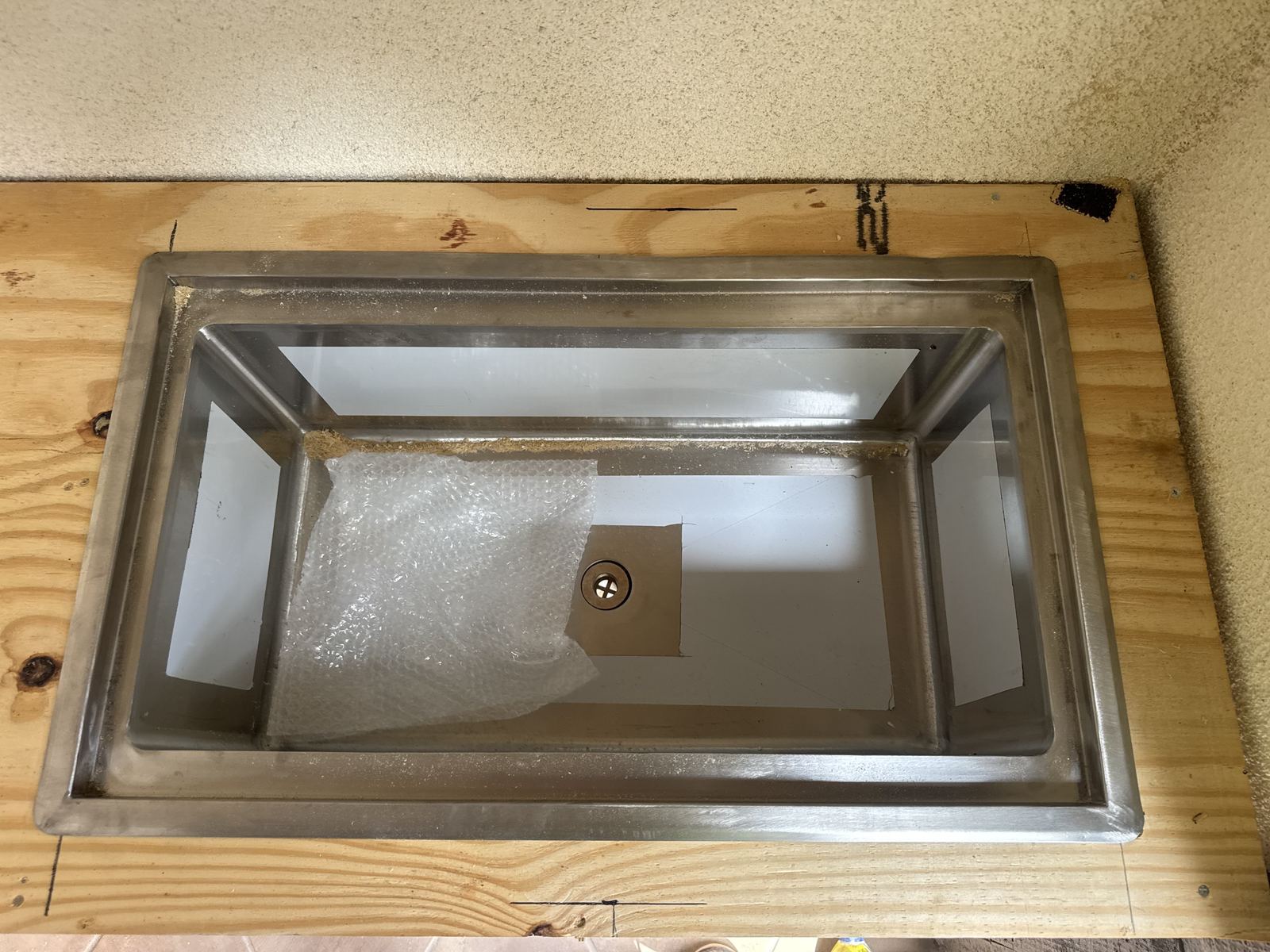 Sink cutout test-fit in the template — countertop fabrication process