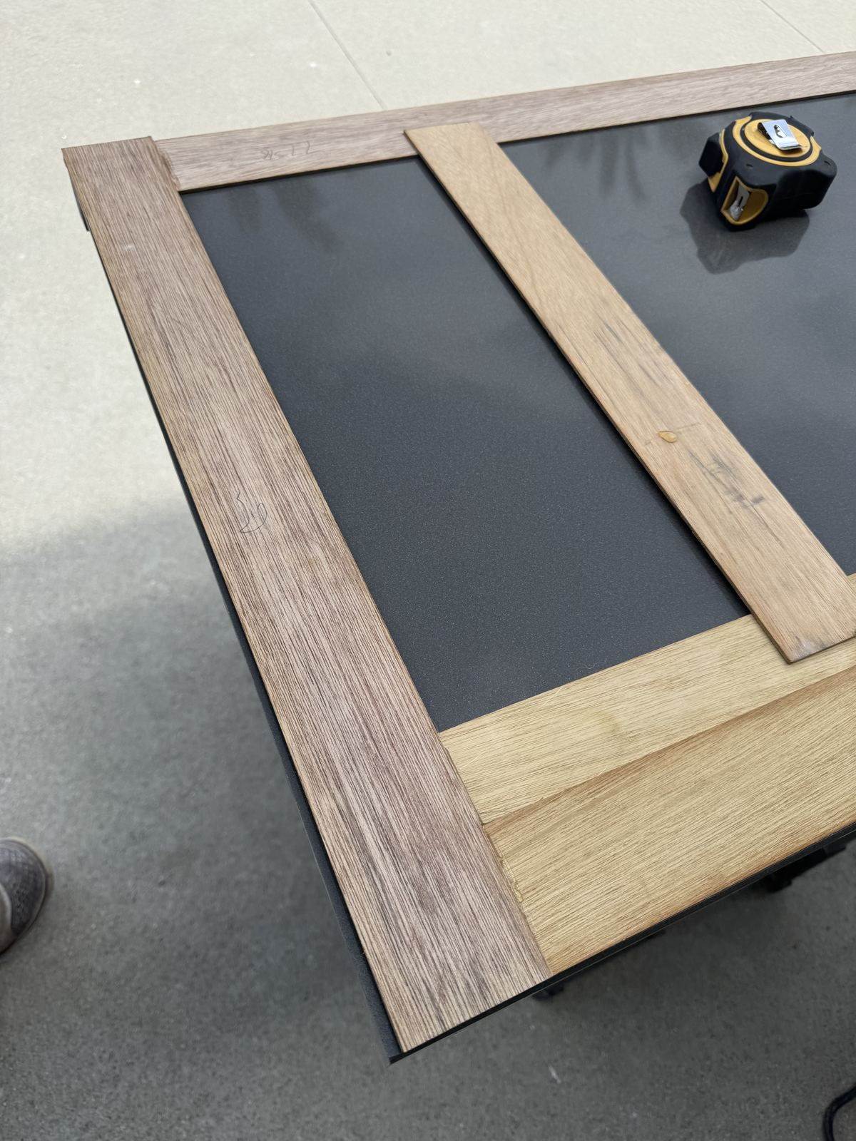 Template frame laid out on the slab — countertop fabrication process